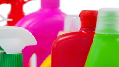 Various detergent containers arranged on white background