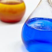 Chemical test flasks with colored lab liquids. Science background. Horizontal