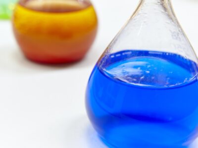 Chemical test flasks with colored lab liquids. Science background. Horizontal