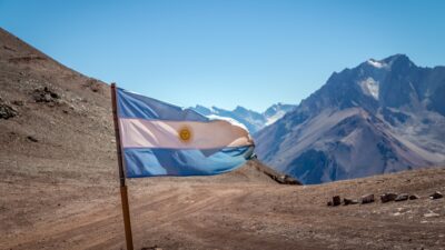 Argentina flag with Cerro Tolosa Mountain in Cordillera de Los Andes - Mendoza Province, Argentina