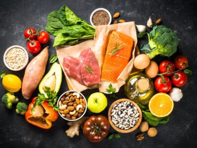 Healthy food products at black background top view