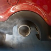 Car smog and air pollution from the exhaust pipe.