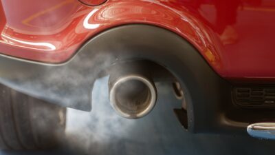 Car smog and air pollution from the exhaust pipe.